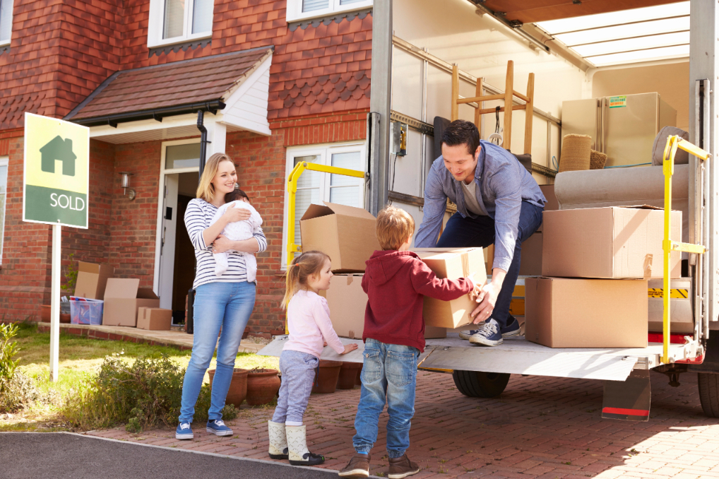 Family Moving Boxes From Removal Truck